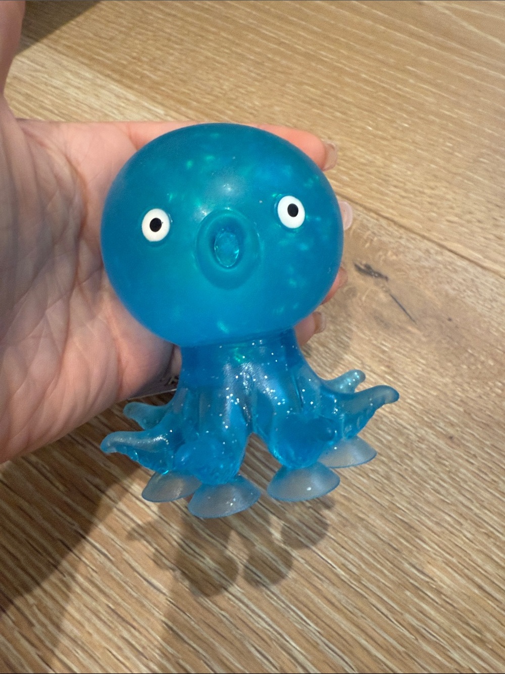 Blue Water and Glitter filled Octopus squeeze Toy with Suction Cup Legs